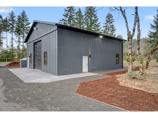 a backyard of a house with garage