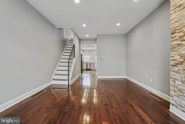 a view of entryway with wooden floor