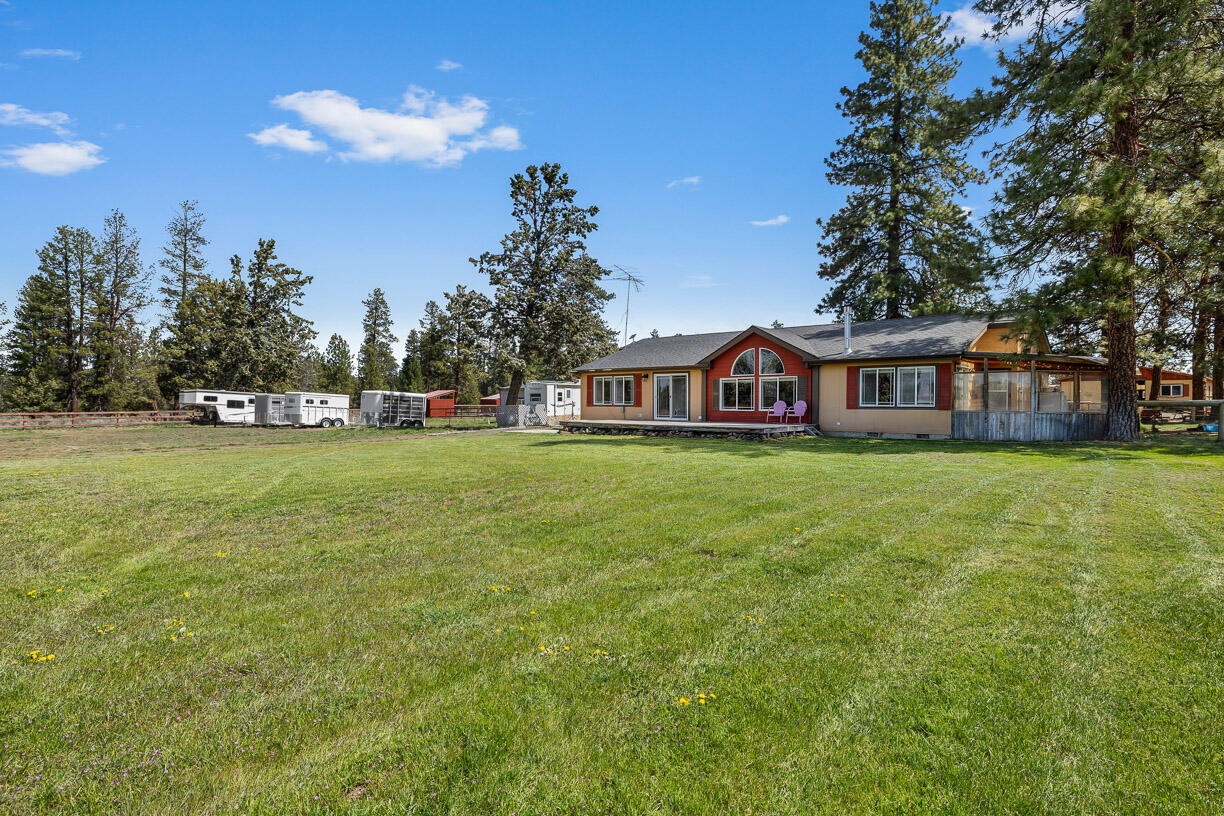 67500 Harrington Loop Road Bend, OR 97703 - Photo 48 of 72 a house view with swimming pool in front of it
