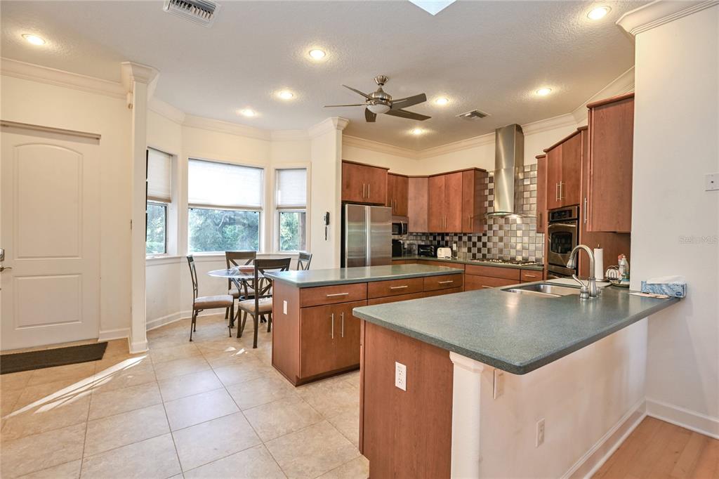 2299 North Bayou Point Inverness, FL 34453 - Photo 14 of 64 a kitchen with a table chairs sink and cabinets
