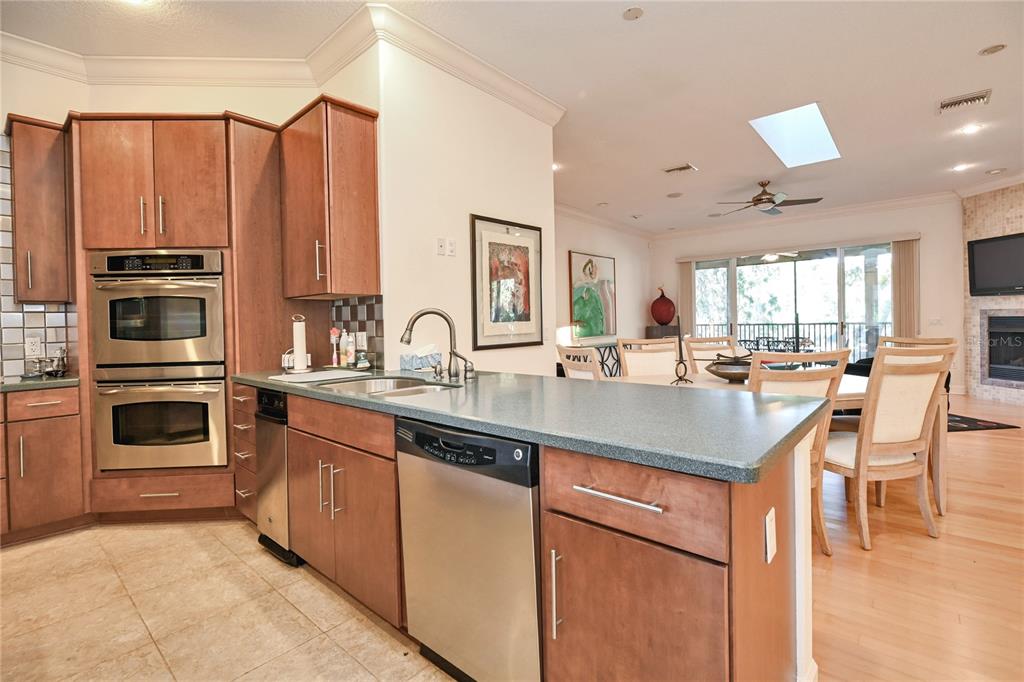 2299 North Bayou Point Inverness, FL 34453 - Photo 16 of 64 a kitchen with stainless steel appliances kitchen island granite countertop a sink and cabinets