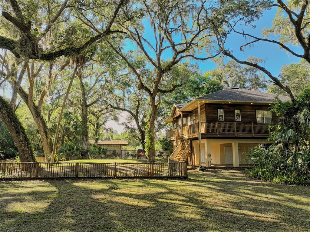 2299 North Bayou Point Inverness, FL 34453 - Photo 2 of 64 a view of a house with a swimming pool