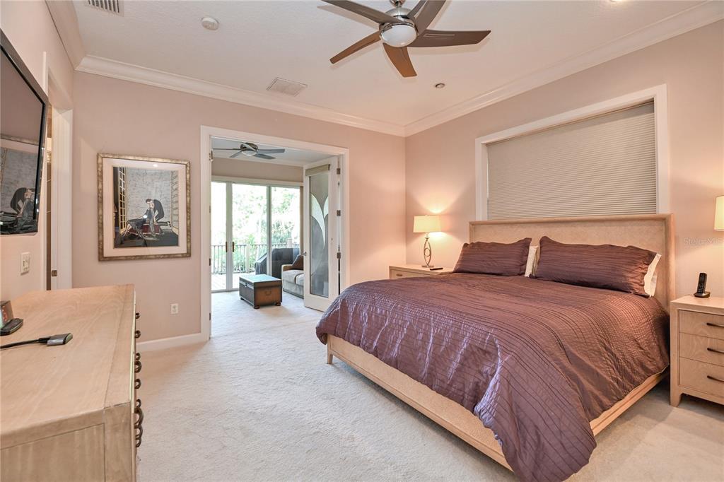 2299 North Bayou Point Inverness, FL 34453 - Photo 21 of 64 a bedroom with a large bed and two windows