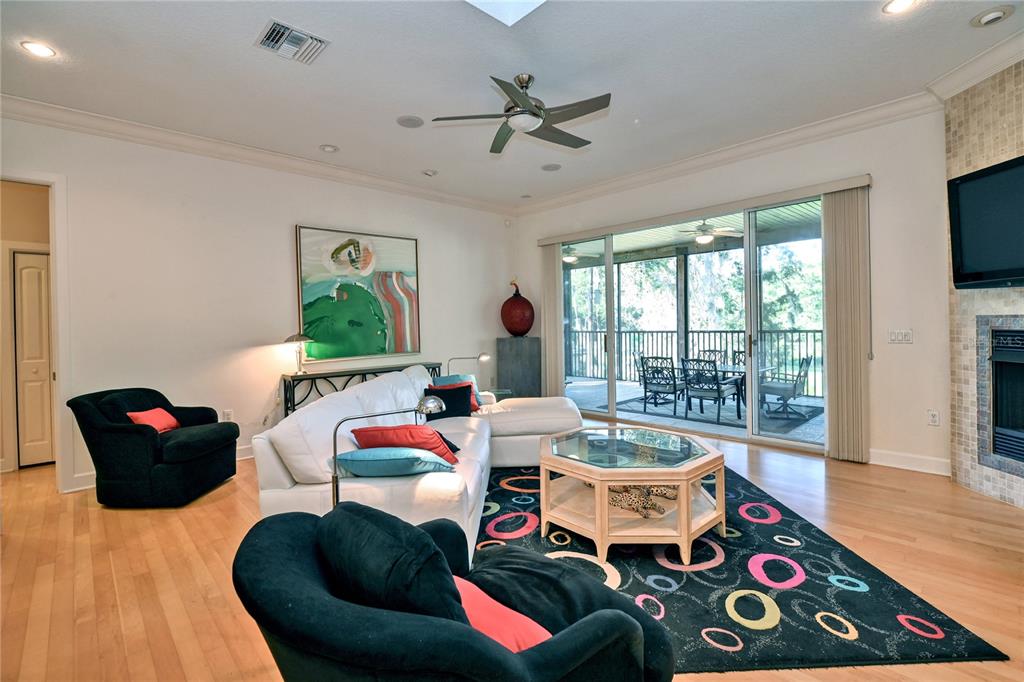 2299 North Bayou Point Inverness, FL 34453 - Photo 23 of 64 a living room with furniture and a floor to ceiling window