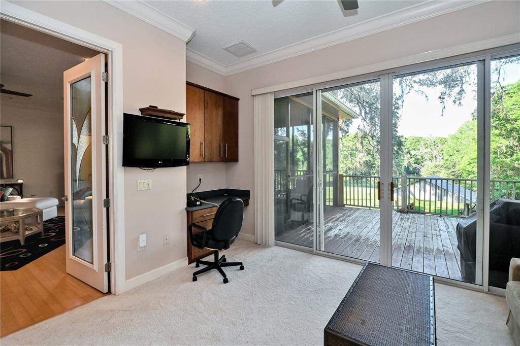 2299 North Bayou Point Inverness, FL 34453 - Photo 28 of 64 a view of a livingroom with workspace and a large window