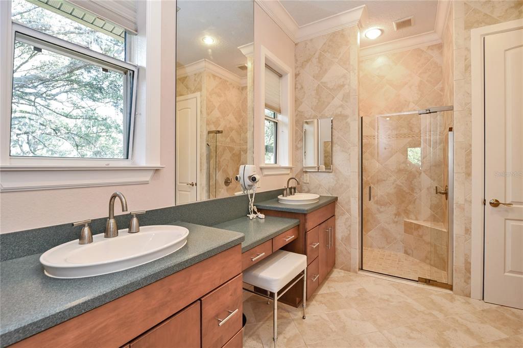 2299 North Bayou Point Inverness, FL 34453 - Photo 29 of 64 a bathroom with a sink double vanity and a mirror