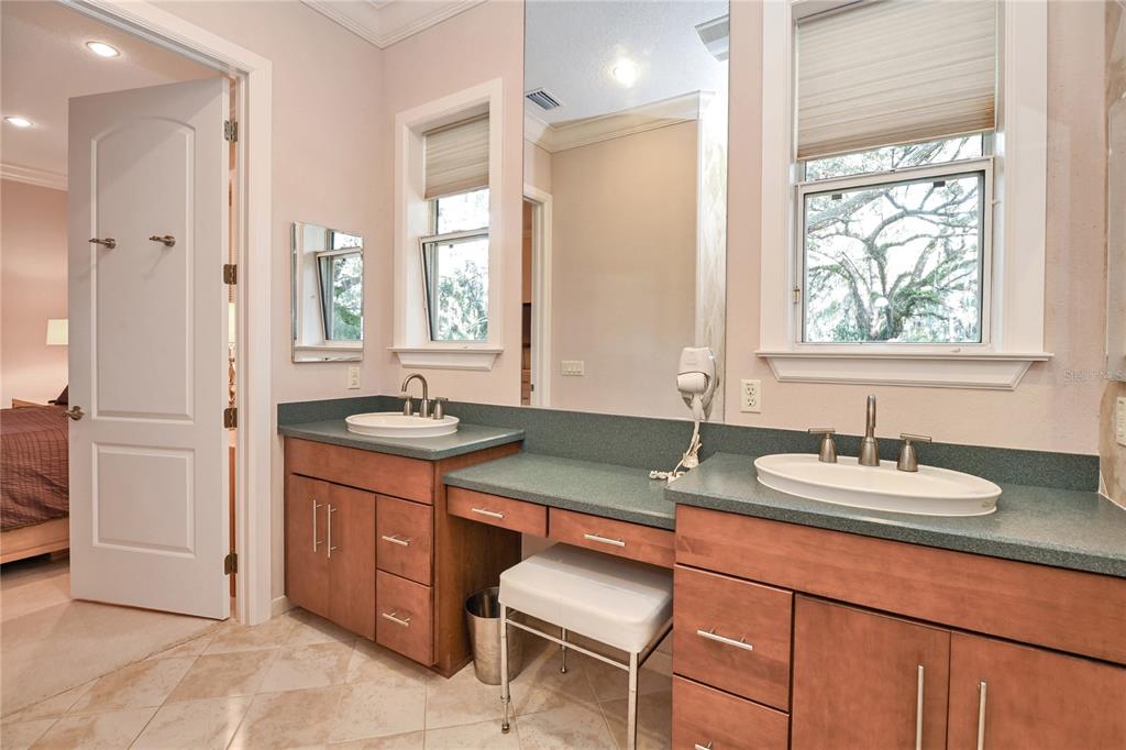 2299 North Bayou Point Inverness, FL 34453 - Photo 30 of 64 a bathroom with a granite countertop sink and a mirror