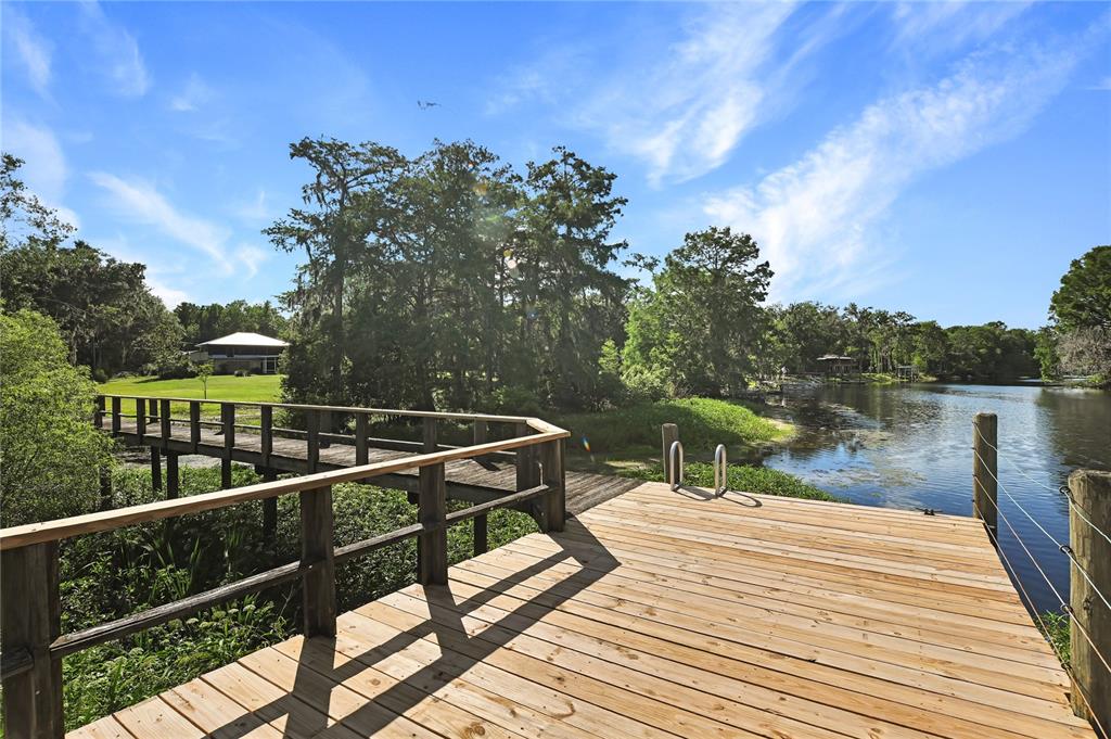 2299 North Bayou Point Inverness, FL 34453 - Photo 58 of 64 a view of a balcony with wooden floor and fence