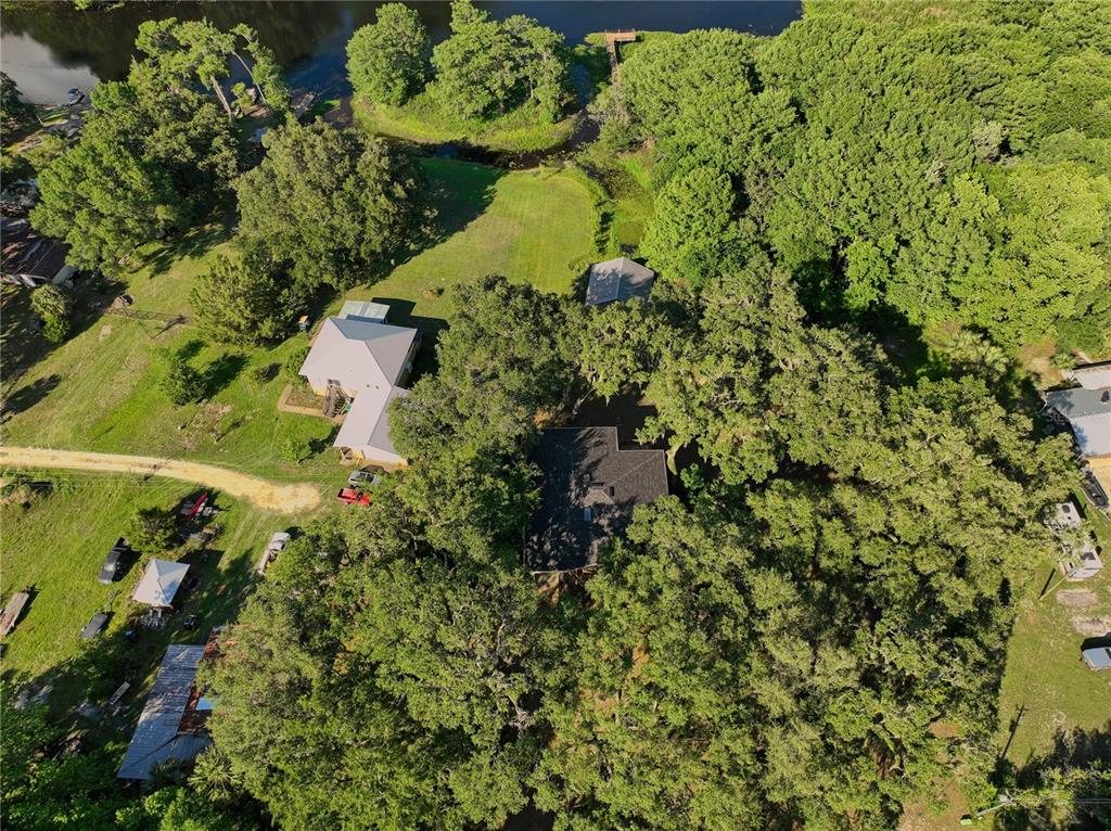 2299 North Bayou Point Inverness, FL 34453 - Photo 64 of 64 an aerial view of a residential houses with yard