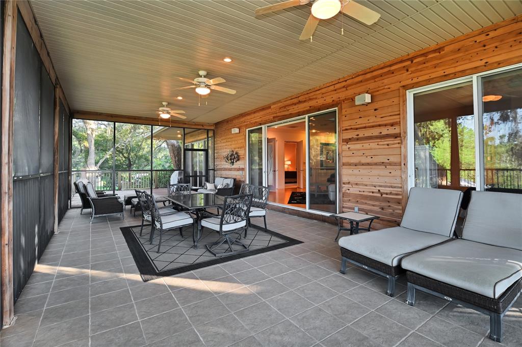 2299 North Bayou Point Inverness, FL 34453 - Photo 8 of 64 a outdoor space with patio the couches and a dining table with garden view