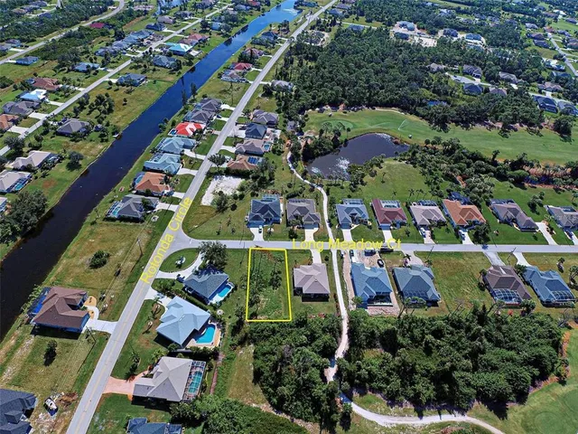an aerial view of multi story residential houses with outdoor space and street view