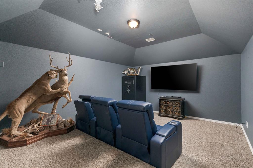1008 Hummingbird Court Forney, TX 75126 - Photo 21 of 34 a living room with furniture and a flat screen tv