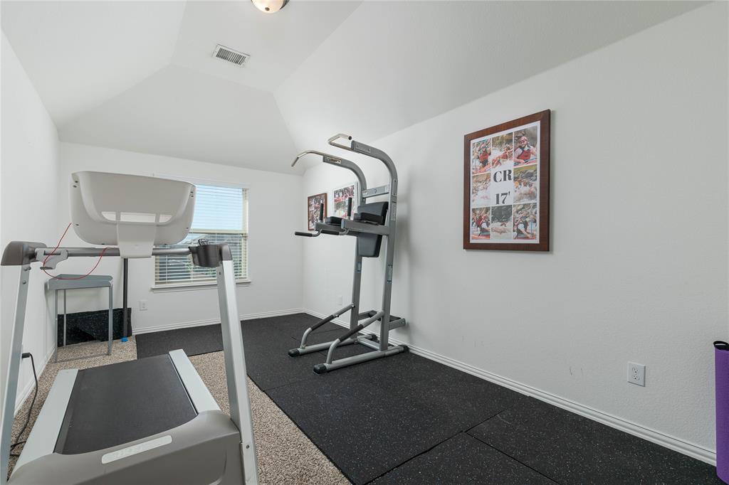1008 Hummingbird Court Forney, TX 75126 - Photo 24 of 34 a view of a workspace with furniture and a mirror