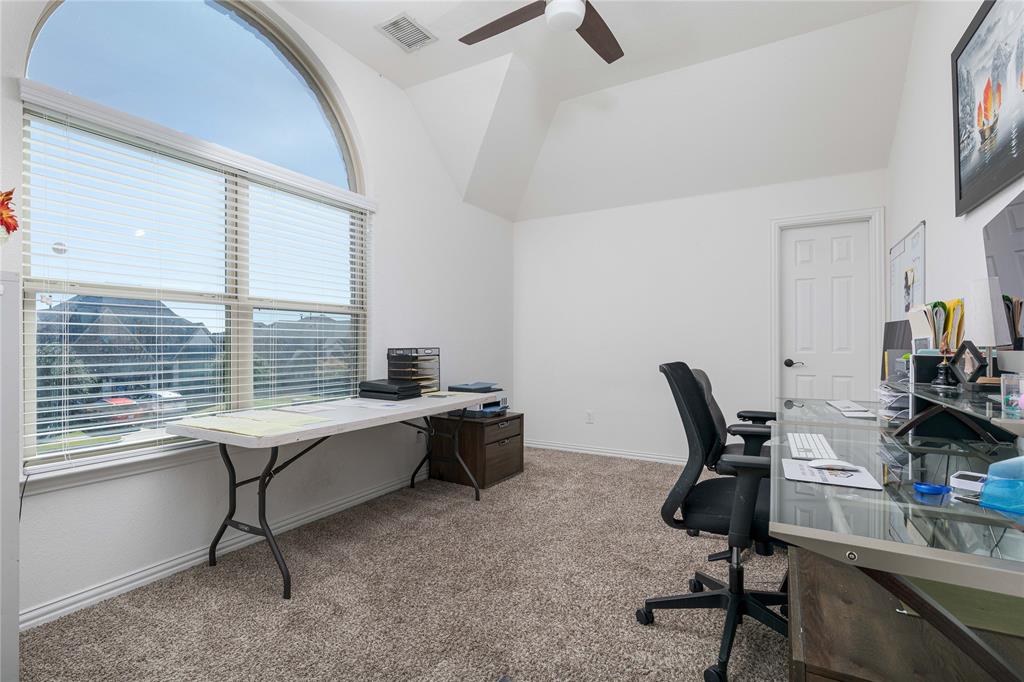 1008 Hummingbird Court Forney, TX 75126 - Photo 25 of 34 a view of a workspace with furniture and a window