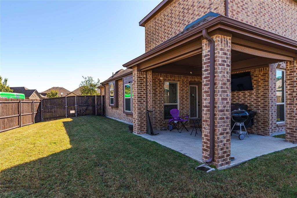 1008 Hummingbird Court Forney, TX 75126 - Photo 29 of 34 a view of a house with a yard and furniture