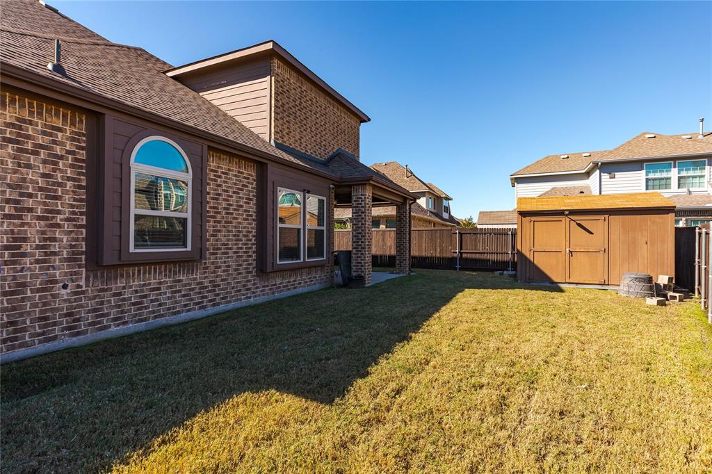 1008 Hummingbird Court Forney, TX 75126 - Photo 31 of 34 a front view of a house with a yard