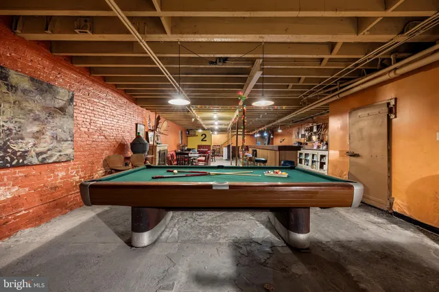 a room with furniture and a projector screen