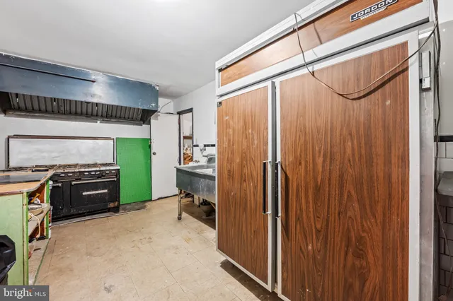 a kitchen with a stove and a sink