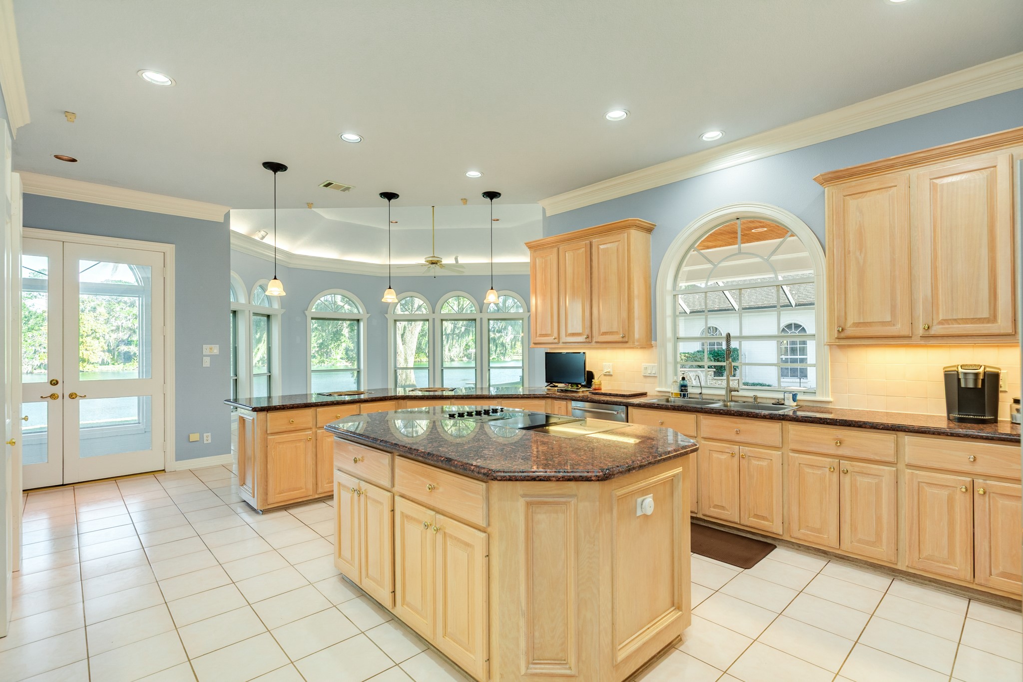 3 Bayou Road Lake Jackson, TX 77566 - Photo 20 of 50 a kitchen with stainless steel appliances granite countertop a sink and a stove
