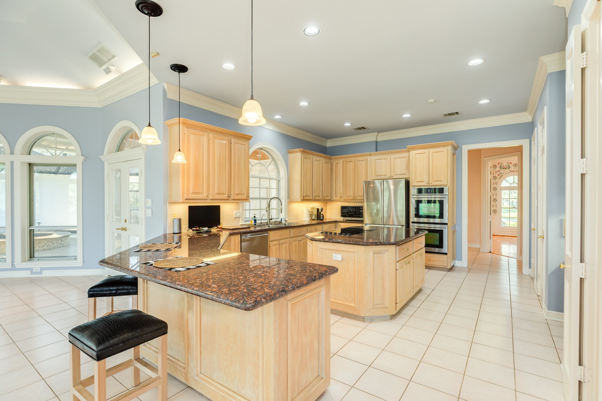 3 Bayou Road Lake Jackson, TX 77566 - Photo 21 of 50 a kitchen with stainless steel appliances granite countertop a sink a stove and a refrigerator