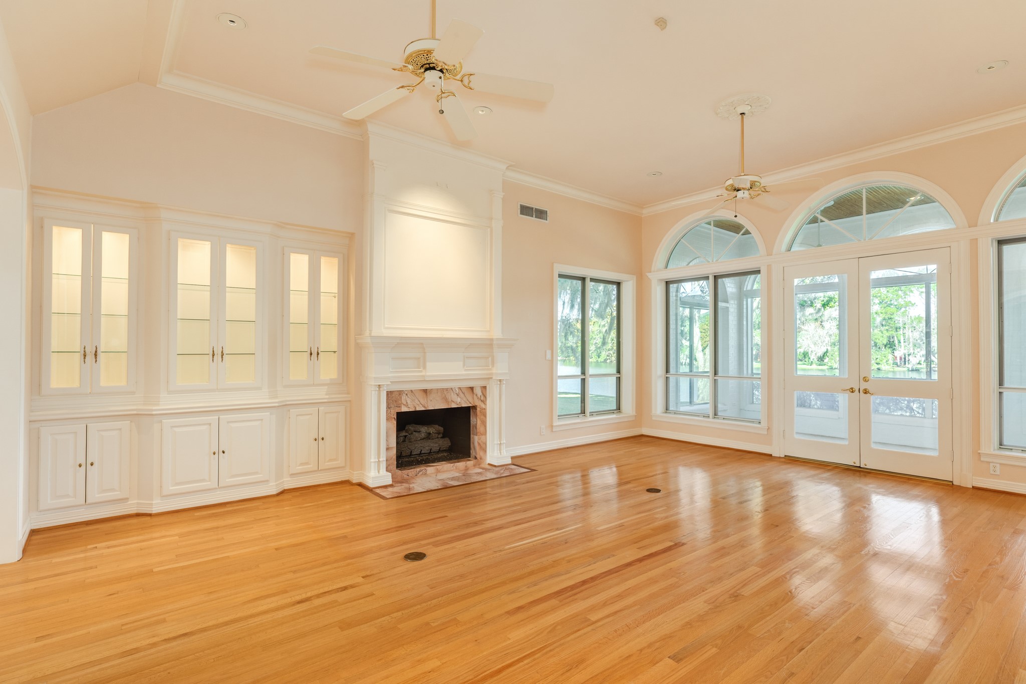 3 Bayou Road Lake Jackson, TX 77566 - Photo 25 of 50 a view of an empty room with a fireplace and a window