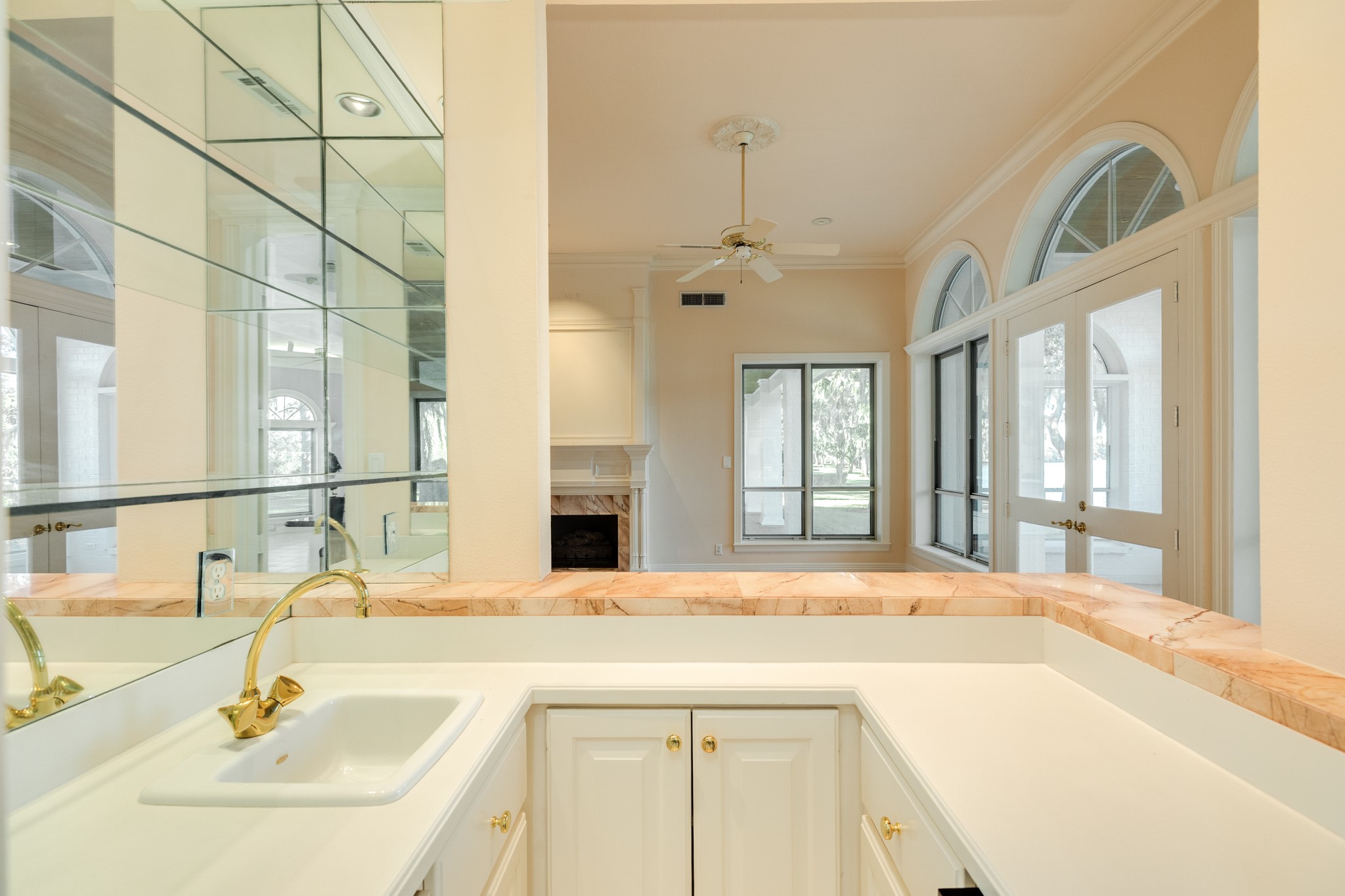 3 Bayou Road Lake Jackson, TX 77566 - Photo 27 of 50 a bathroom with a sink and a large mirror