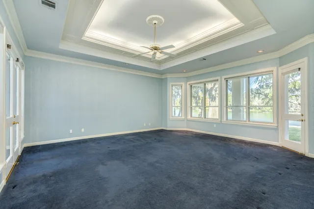 a spacious bathroom with a tub sink shower and mirror
