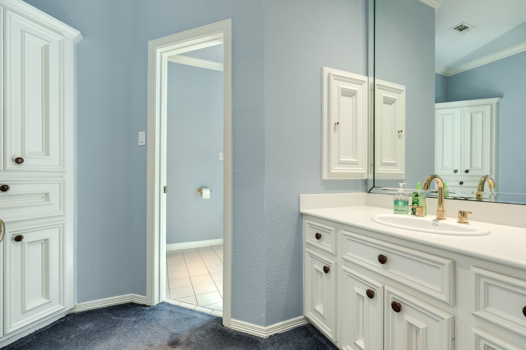 3 Bayou Road Lake Jackson, TX 77566 - Photo 36 of 50 a spacious bathroom with a double vanity sink a mirror and a