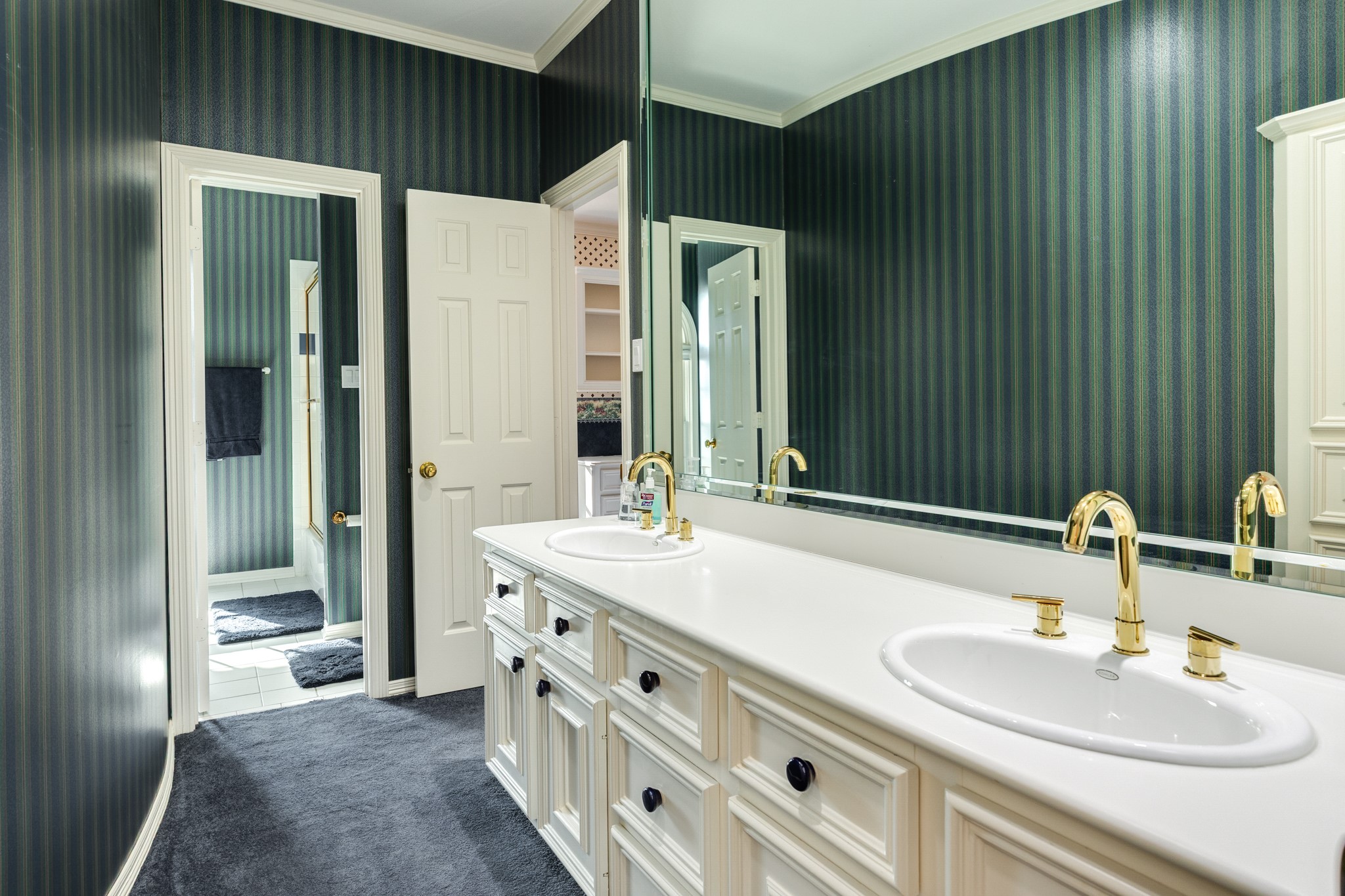 3 Bayou Road Lake Jackson, TX 77566 - Photo 38 of 50 a bathroom with a double vanity sink and a mirror