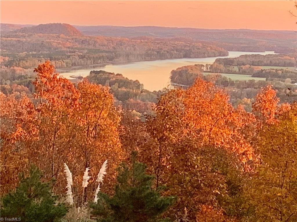 848 Sierra Trace Road Denton, NC 27239 - Photo 42 of 47 Exceptional elevated views overlooking Tuckertown Lake and the surrounding valley, showcasing the beauty of every season.