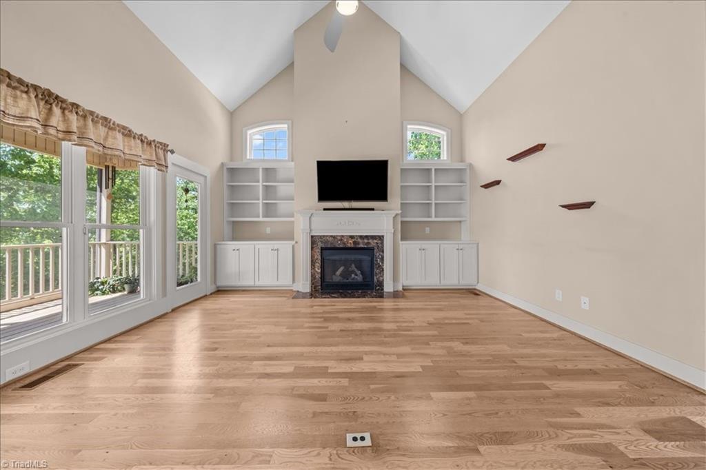 848 Sierra Trace Road Denton, NC 27239 - Photo 10 of 47 Vaulted ceilings, built in and gas log fireplace