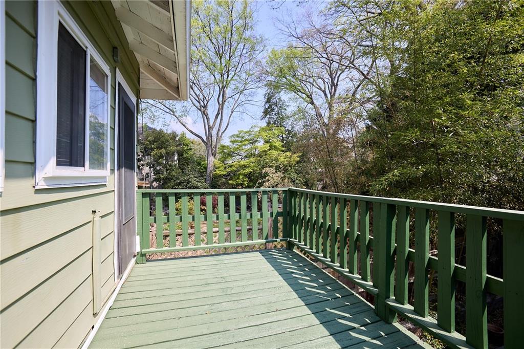 887 Myrtle Street Northeast, Unit 5 Atlanta, GA 30309 - Photo 11 of 11 a view of balcony with wooden floor and fence
