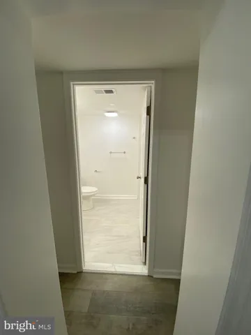 a bathroom with a sink toilet and a mirror