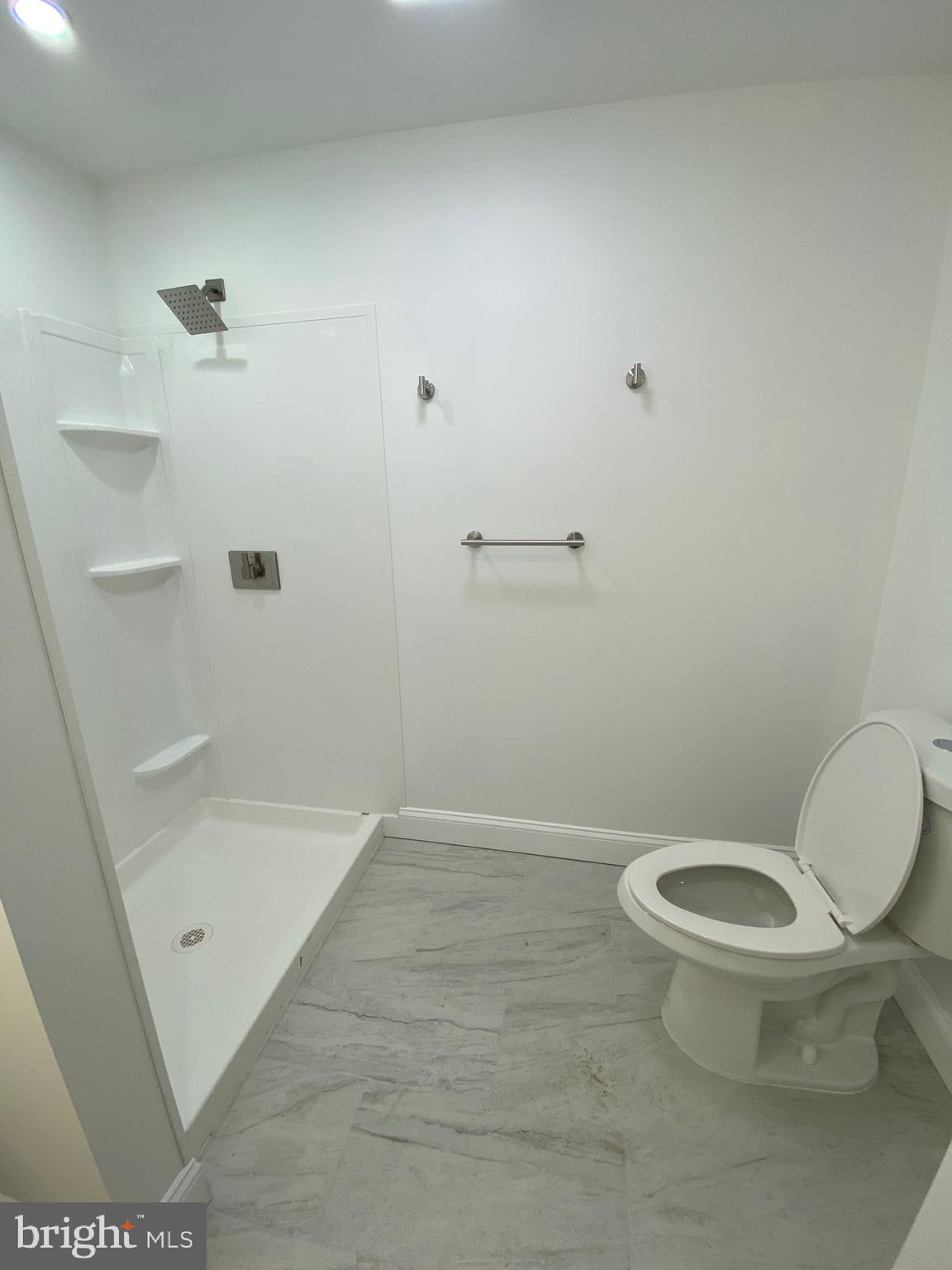 45 East High Street, Unit 1ST FLOOR/3 BEDROOM Pottstown, PA 19464 - Photo 23 of 25 a bathroom with a toilet and a shower