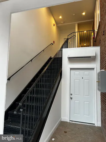 a view of entryway with a front door