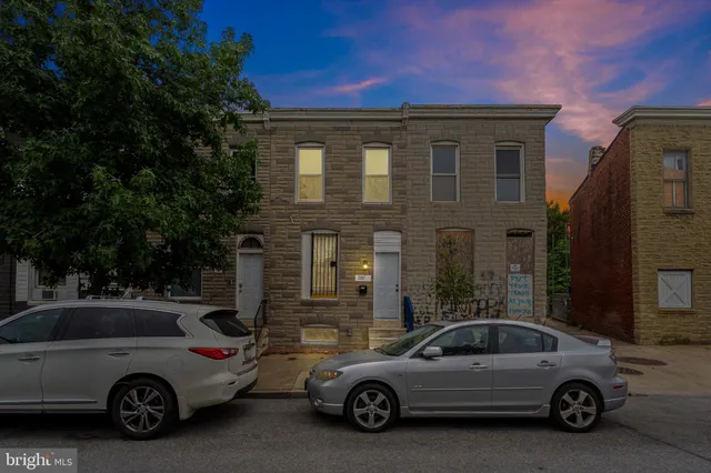 a view of a car parked in front of a house