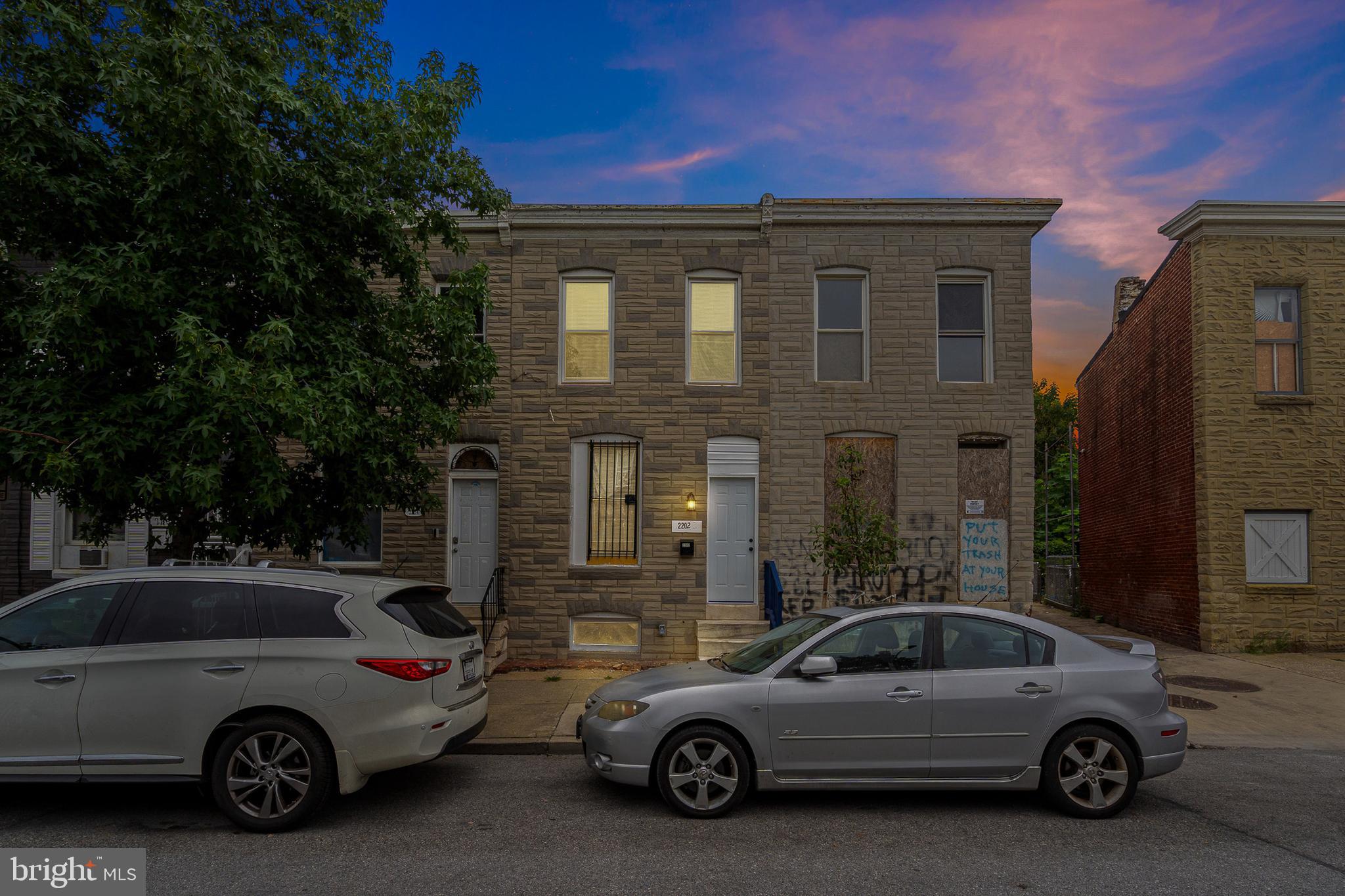 a view of a car parked in front of a house