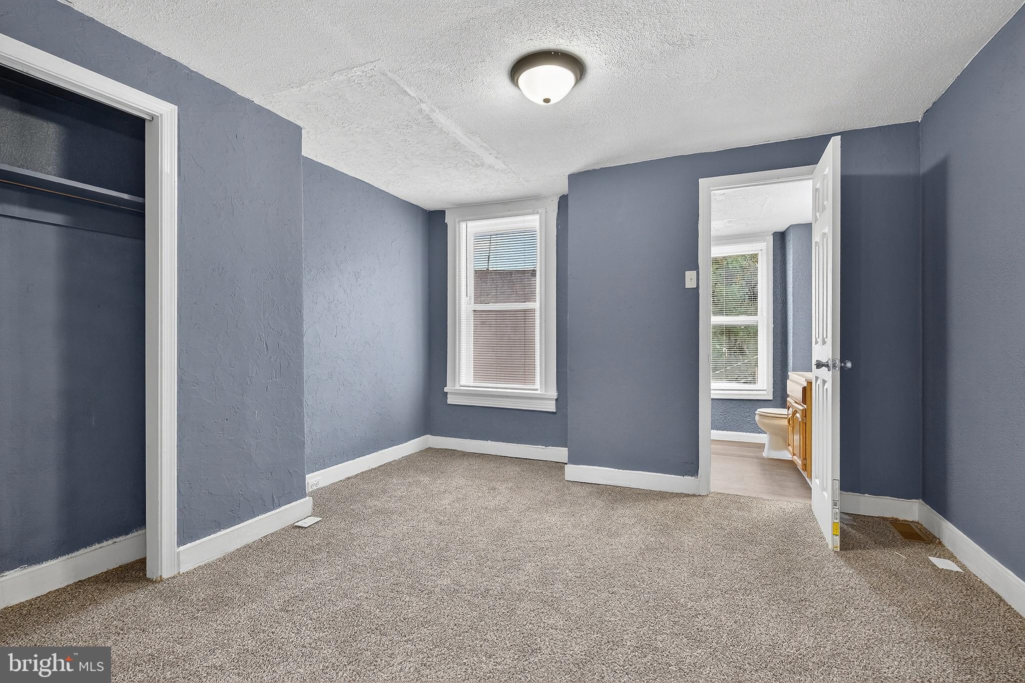 2202 Ashton Street Baltimore, MD 21223 - Photo 18 of 35 an empty room with windows