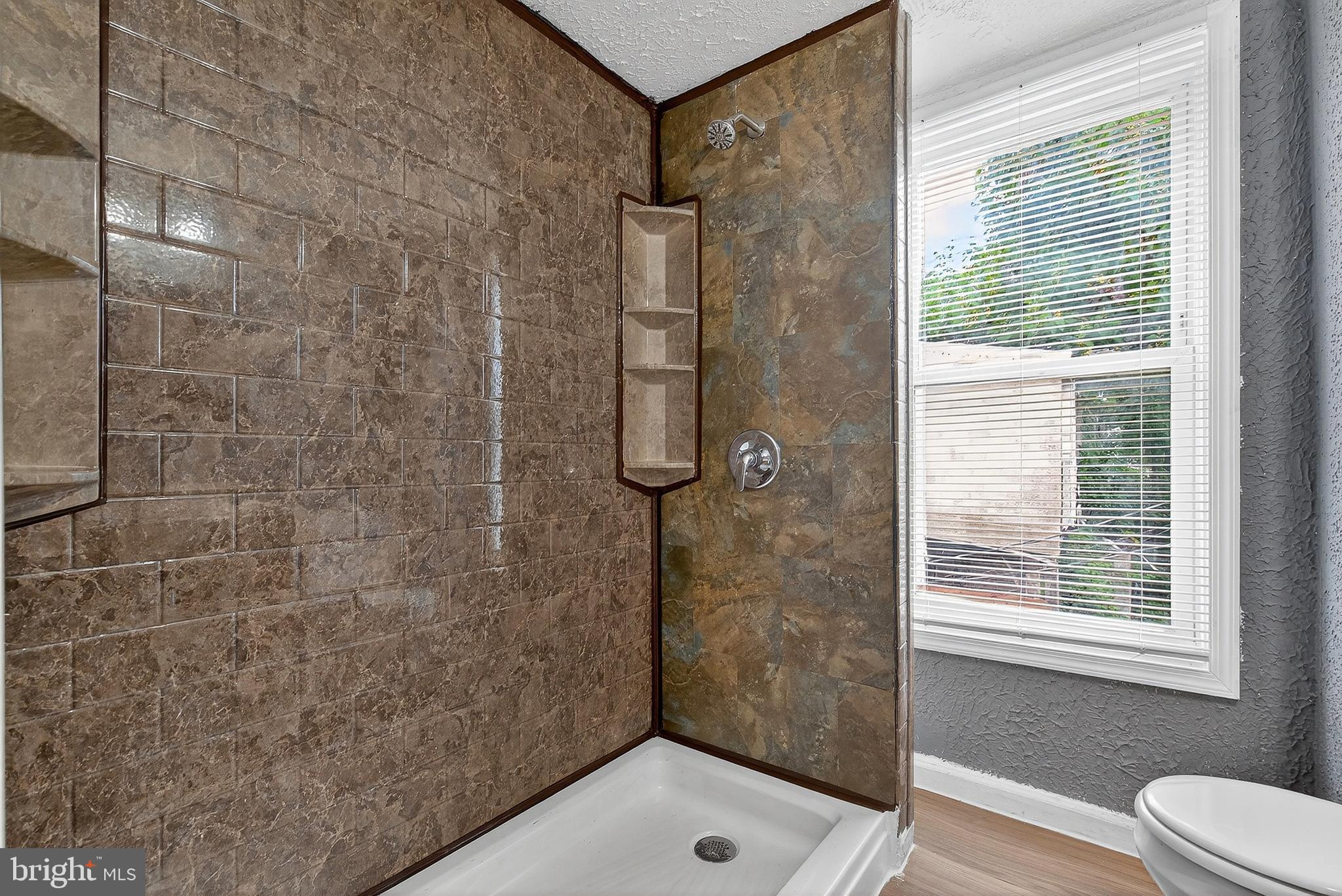 2202 Ashton Street Baltimore, MD 21223 - Photo 21 of 35 a bathroom with a shower and toilet