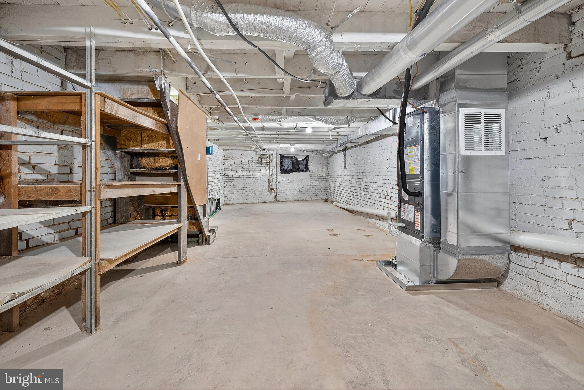 2202 Ashton Street Baltimore, MD 21223 - Photo 27 of 35 a view of an empty room with wooden floor