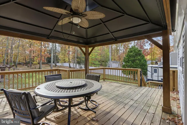 a view of a chairs and table in the balcony