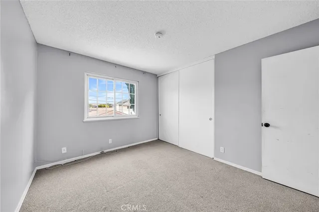a view of a patio with wooden floor and fence