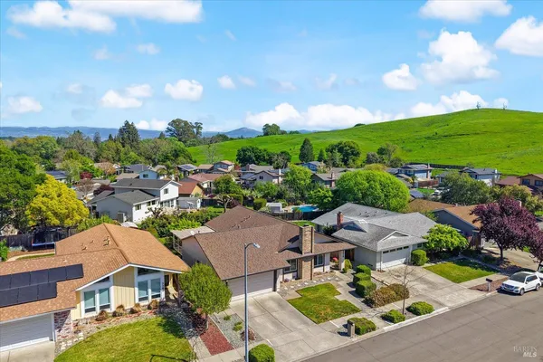an aerial view of a houses with a garden