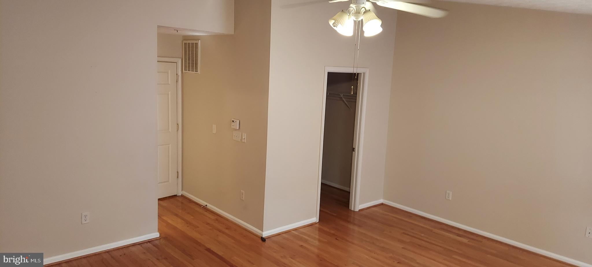8089 Brookstone Court Severn, MD 21144 - Photo 27 of 33 a view of a hallway with wooden floor