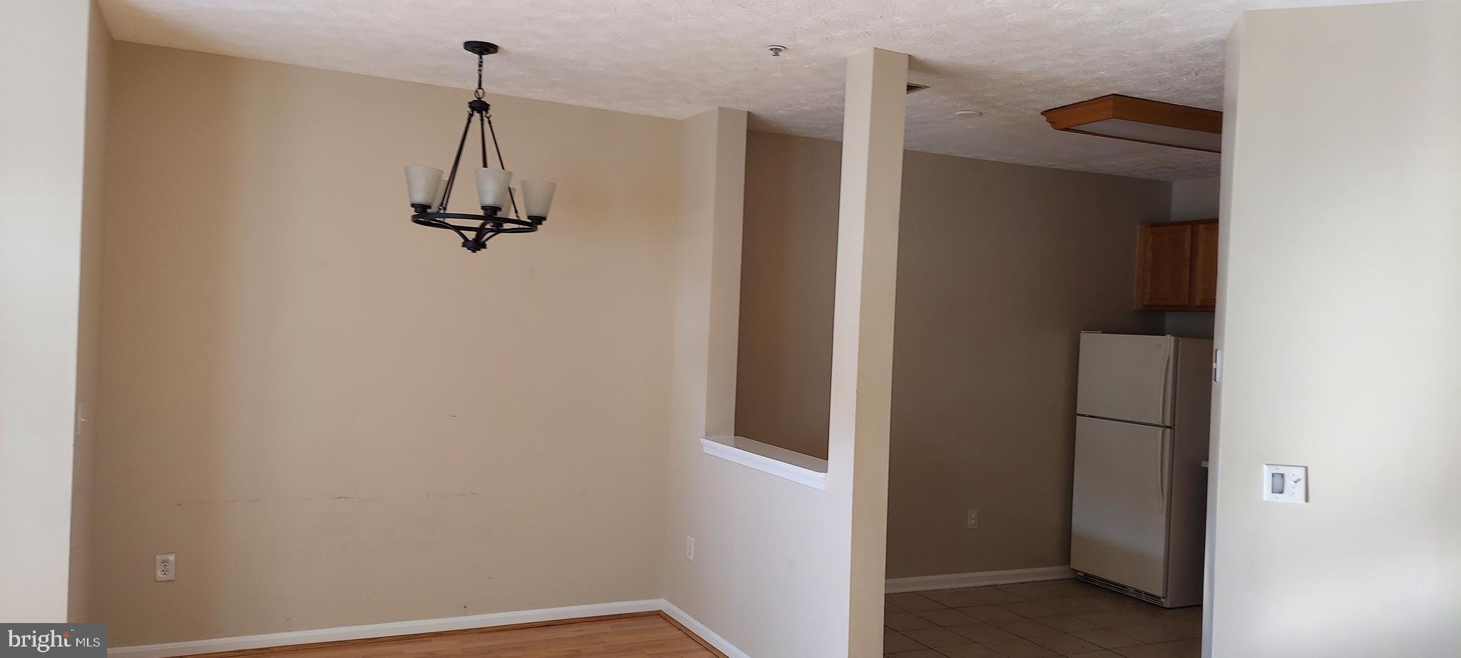8089 Brookstone Court Severn, MD 21144 - Photo 9 of 33 a view of small space with a refrigerator