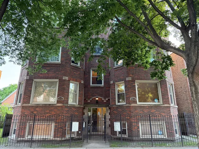 front view of a house with a tree