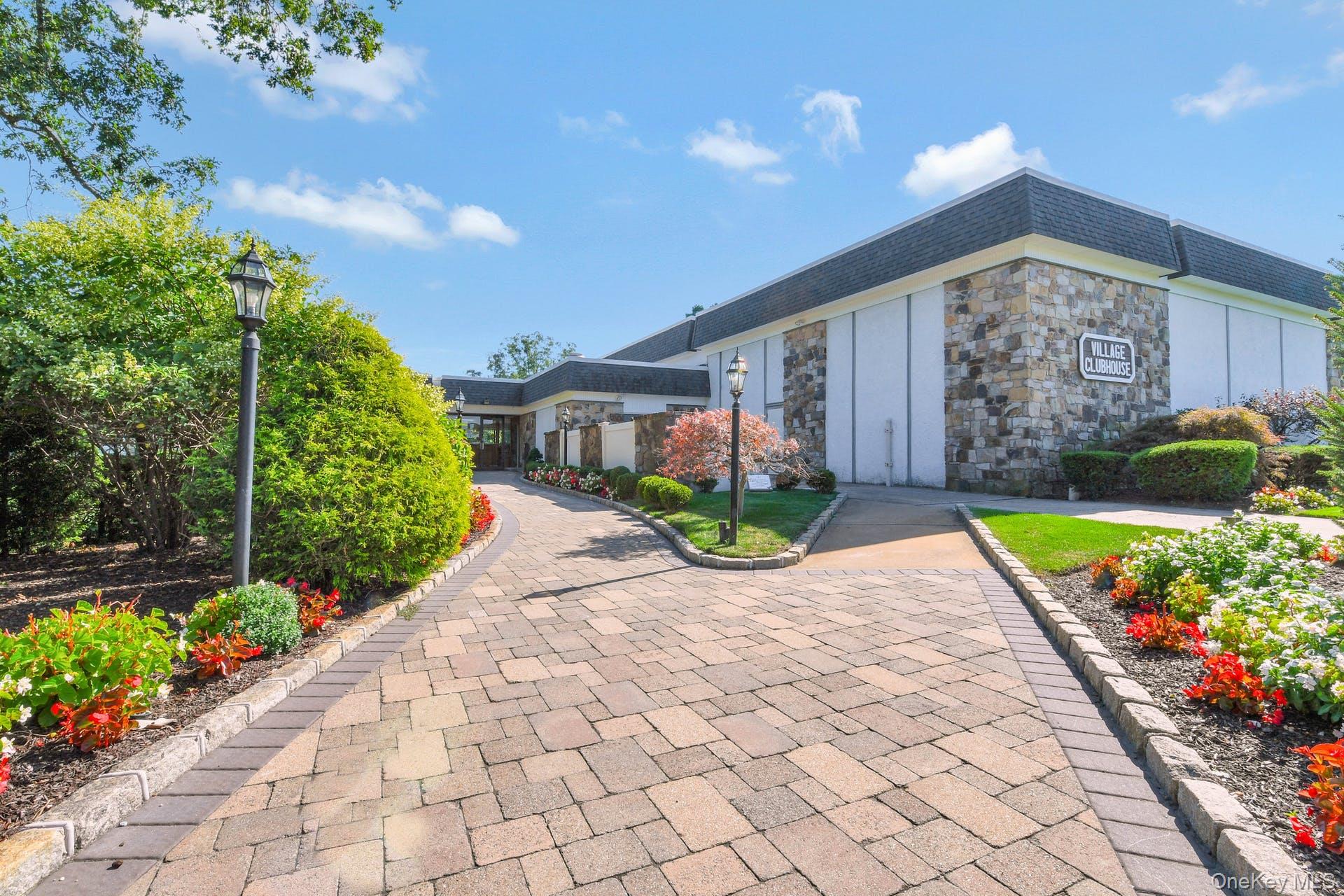 310 C Woodbridge Drive Ridge, NY 11961 - Photo 21 of 24 a view of a backyard with potted plants