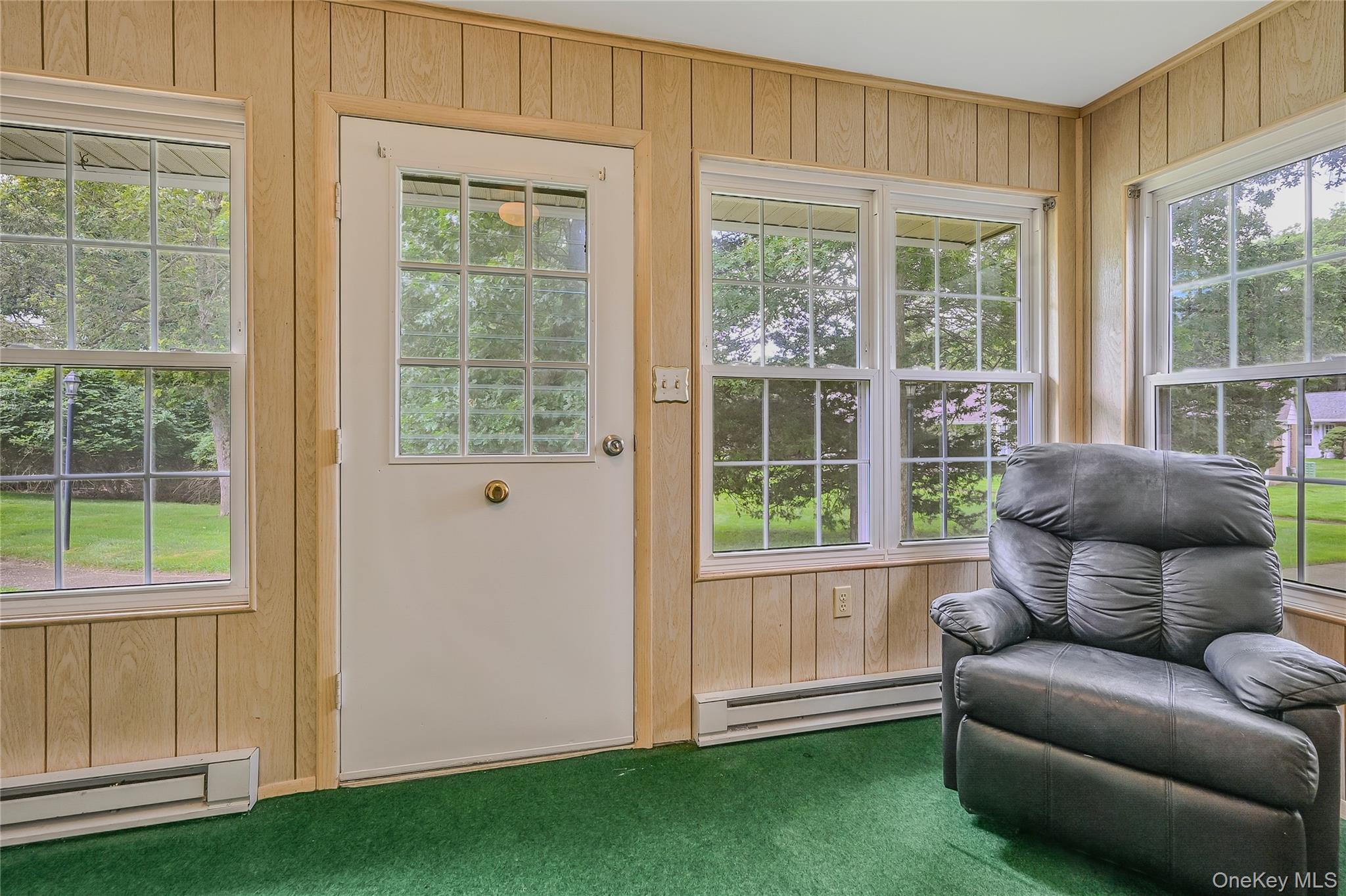 310 C Woodbridge Drive Ridge, NY 11961 - Photo 10 of 24 a living room with furniture and a window