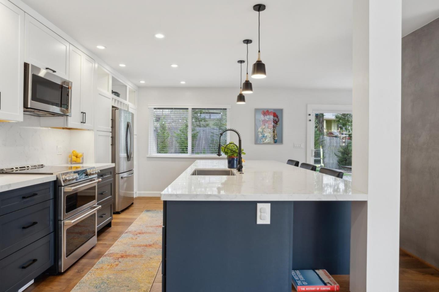 4095 Sunset Lane Pebble Beach, CA 93953 - Photo 11 of 55 a large kitchen with stainless steel appliances granite countertop a sink a stove and a refrigerator