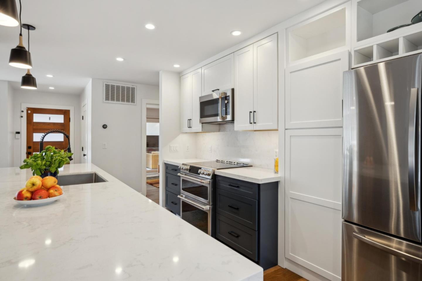 4095 Sunset Lane Pebble Beach, CA 93953 - Photo 15 of 55 a kitchen with stainless steel appliances a refrigerator and a stove